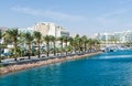 Entrance to marina, with promenades, modern hotel complexes, palms, Eilat, Israel